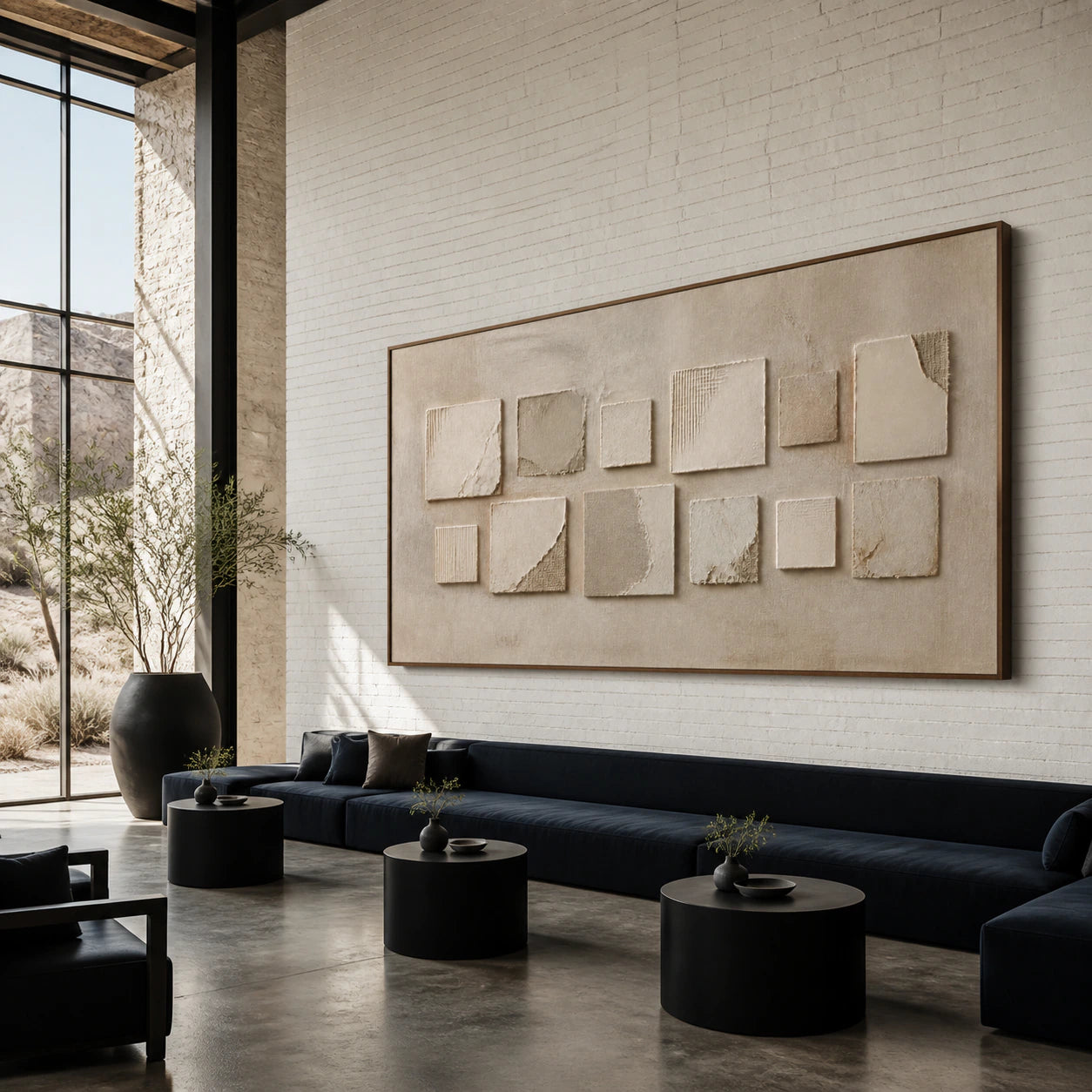 Quiet-Relief anchoring an expansive, bright loft hospitality interior.