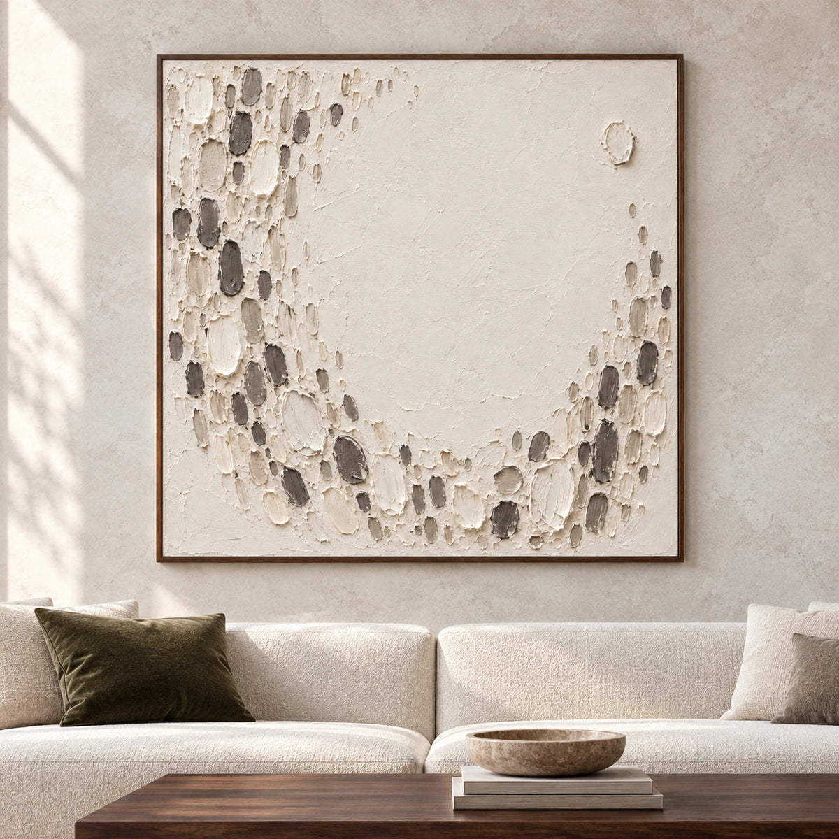 Large square ivory and charcoal textured abstract displayed straight-on in a spacious room.
