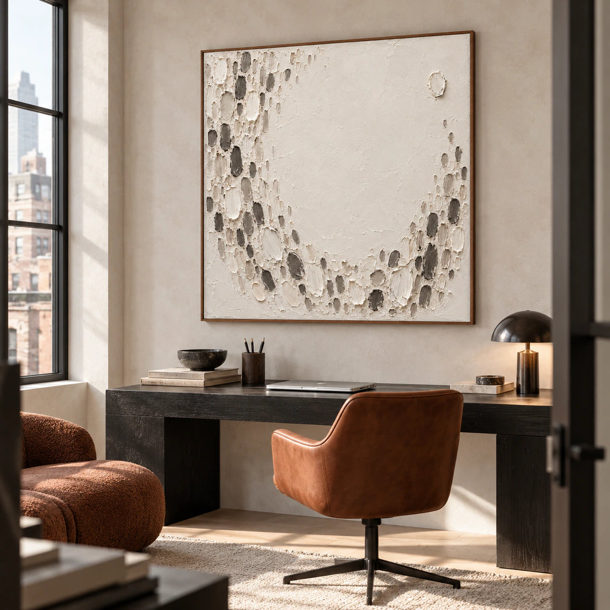 Square ivory and charcoal textured abstract in an airy home office with a simple desk and reading chair.