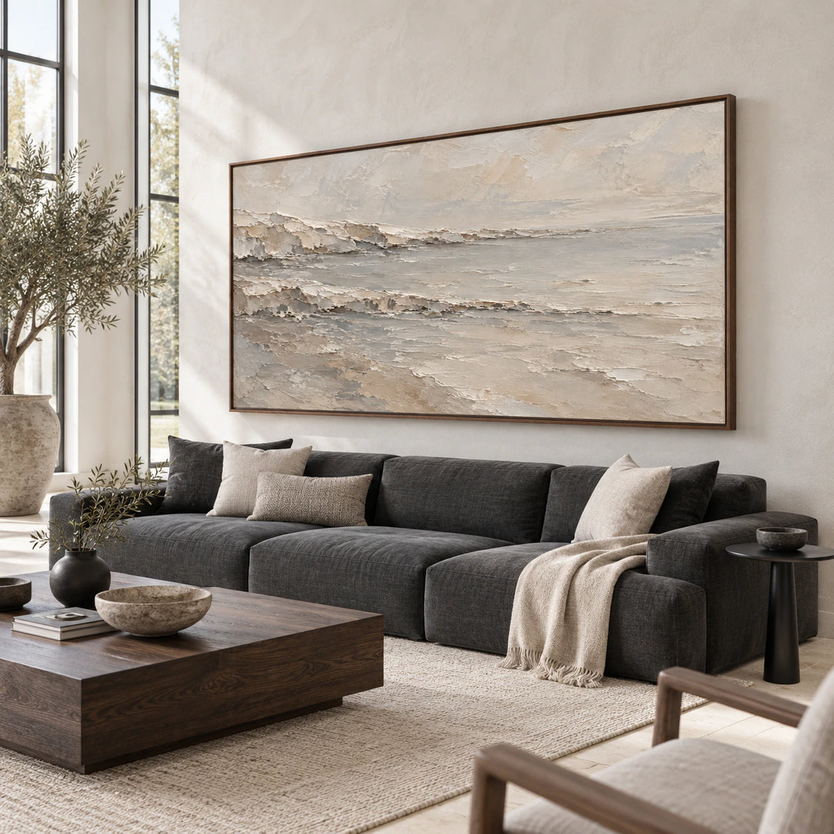 Quiet-Strata panoramic textured wall art above a sofa in a bright living room.