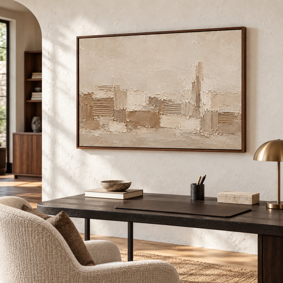 In an airy home office, Raked Passage artwork fills the wall above a slim desk, viewed from the right with daylight and soft shadow detail.