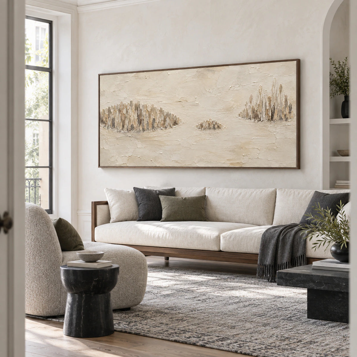 Reed-Quiet above a restrained sofa in a bright daylight living room.