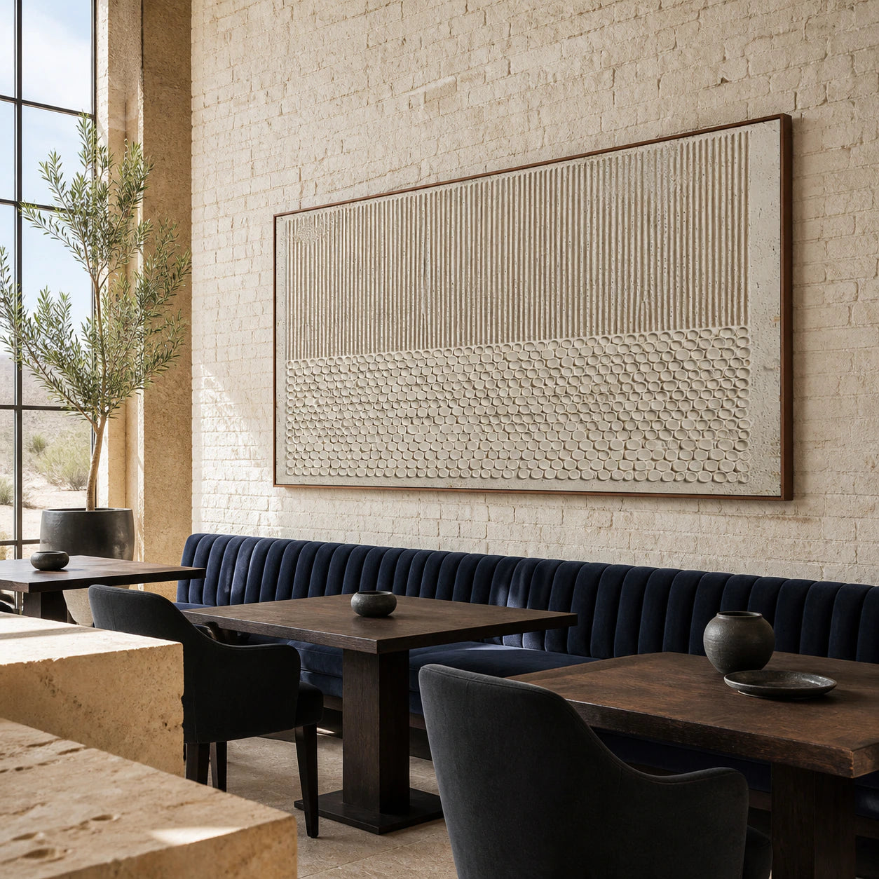 Reed-Relief as a large focal artwork in an open hospitality loft interior.
