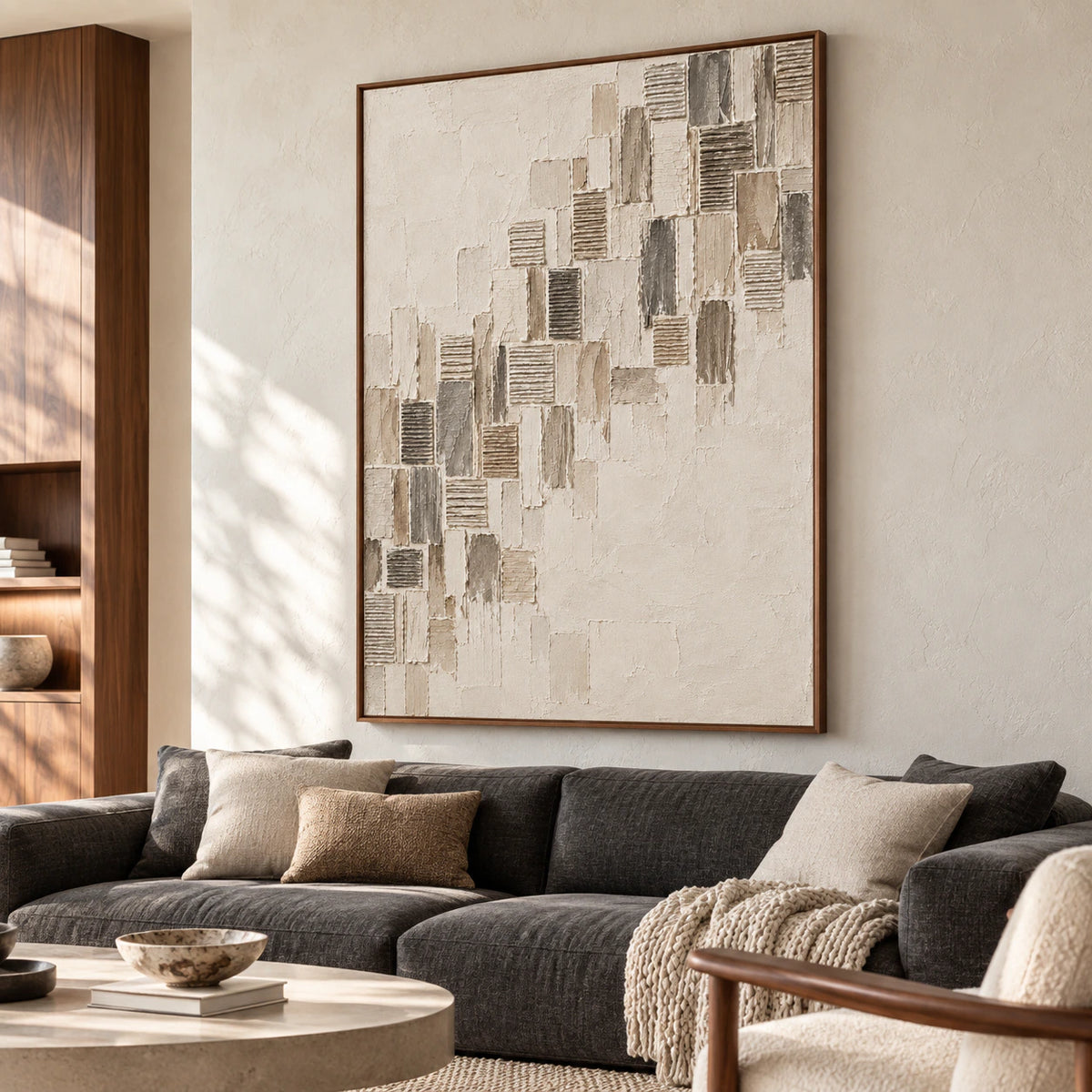 Ribbed-Ascent displayed at large scale above a low charcoal sofa in a bright living room with pale plaster walls and natural daylight.