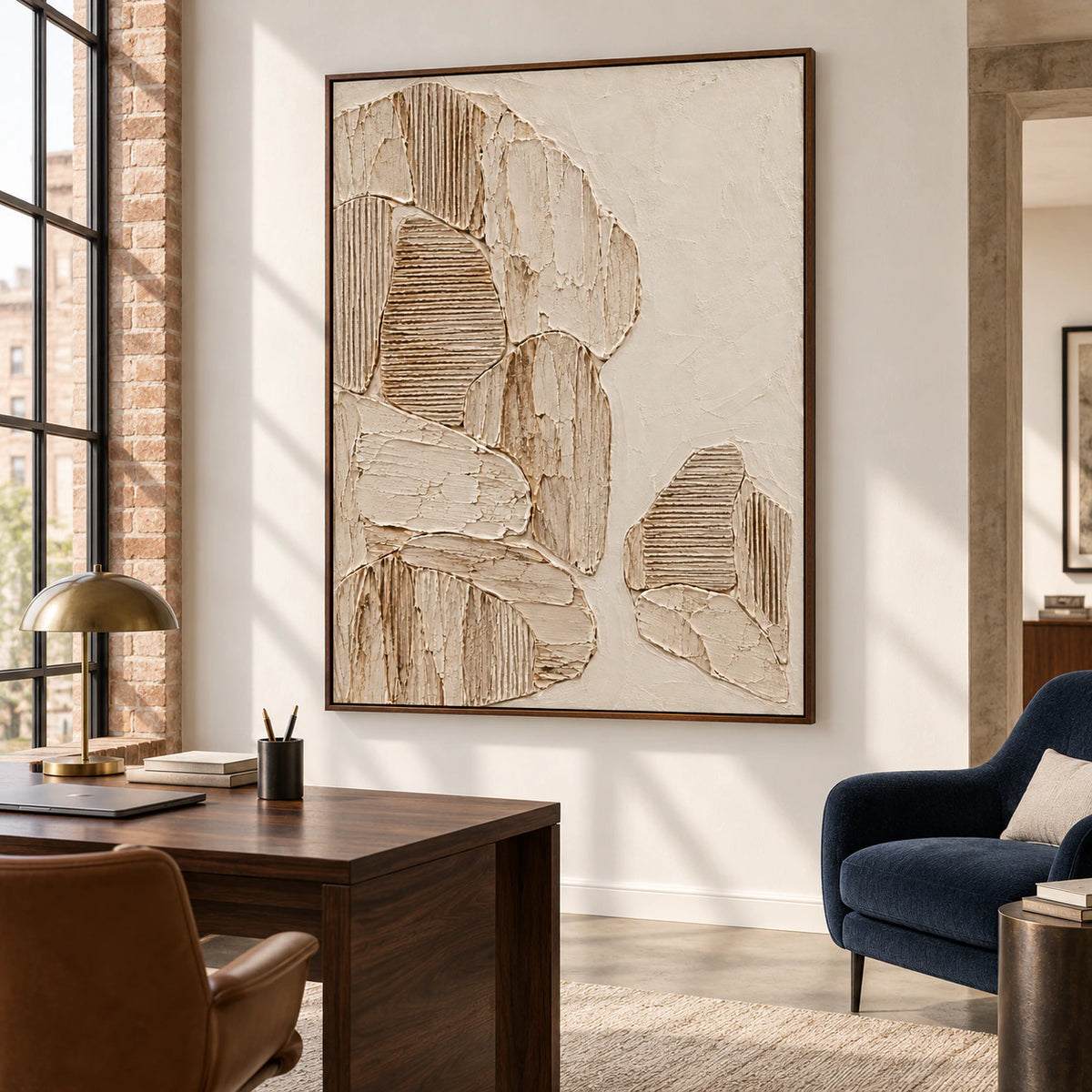 Large ribbed abstract artwork in an airy reading office with a simple desk, dark wood accents, and broad daylight.