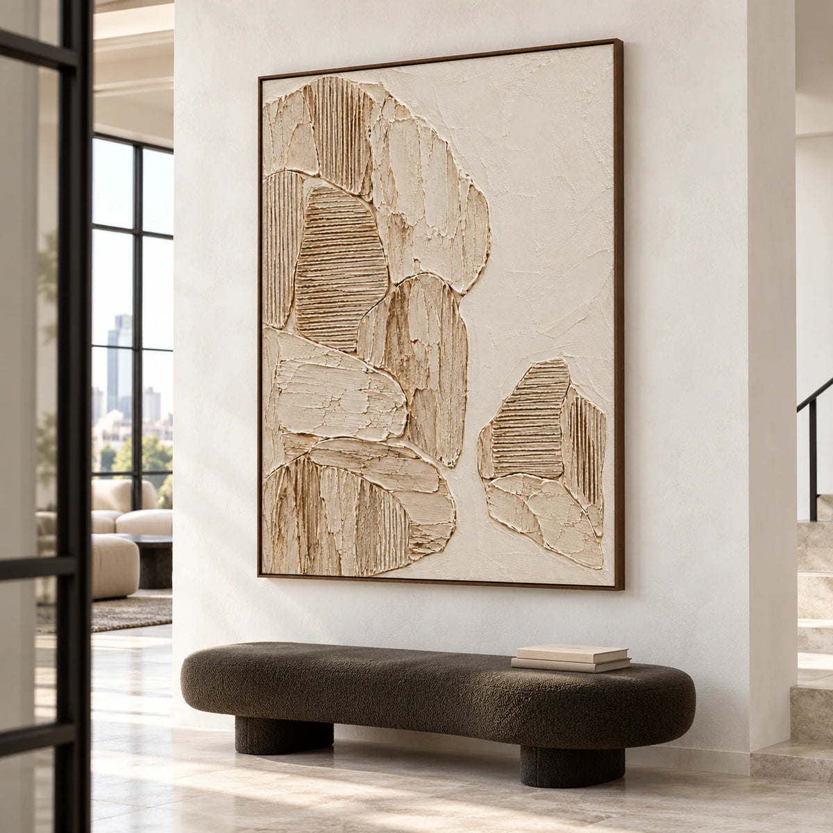 Monumental parchment relief artwork anchoring a gallery-scale foyer with stone flooring and a restrained black bench.