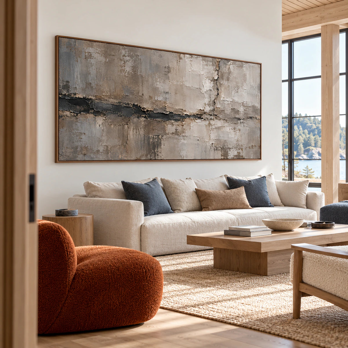 Riven-Mantle on a long wall in a spacious hospitality loft with high ceilings, large windows and muted blue and natural wood furniture, viewed from the right.