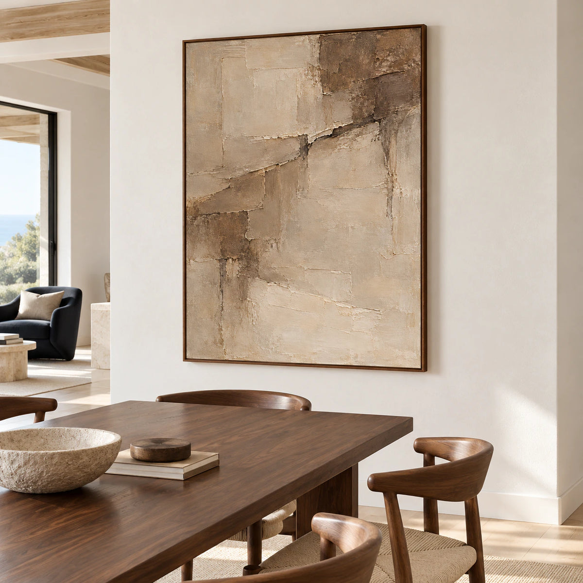 Riven-Parchment artwork anchoring a refined dining room with a dark wood table, sculptural chairs and natural daylight.