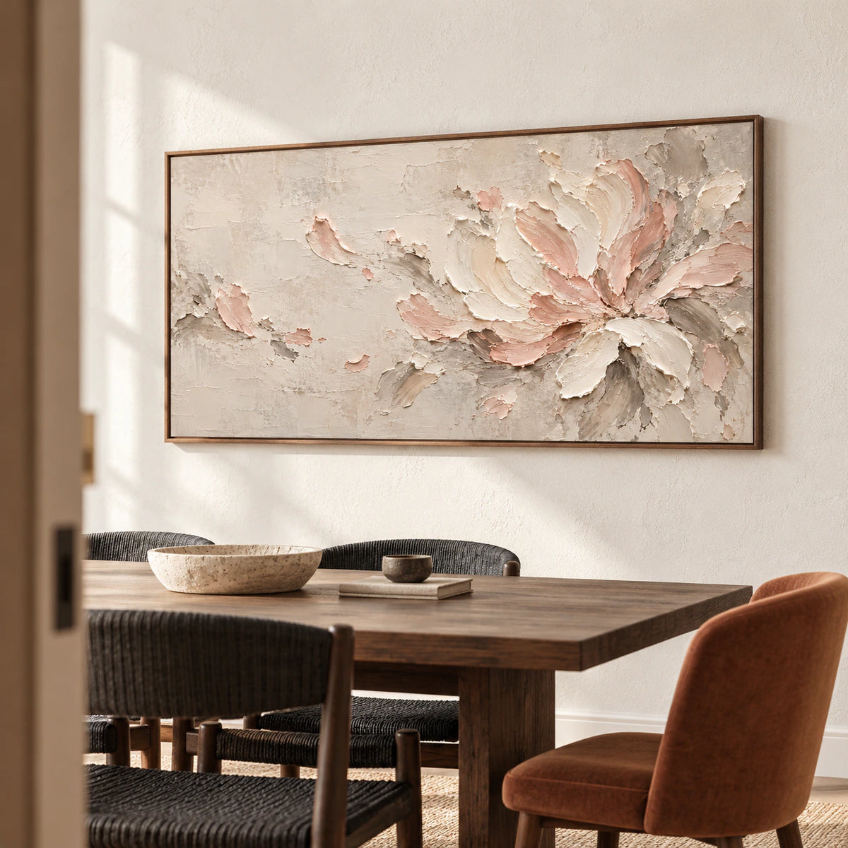 Horizontal floral abstract on a textured warm-white dining room wall above a dark wood table and charcoal seating, viewed from the right.