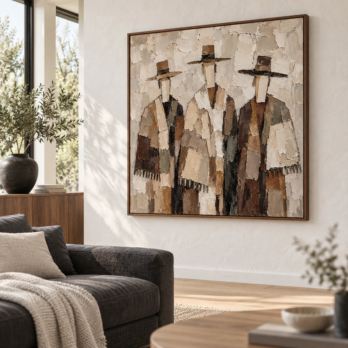 Square figure artwork as the focal point in a bright contemporary living room.