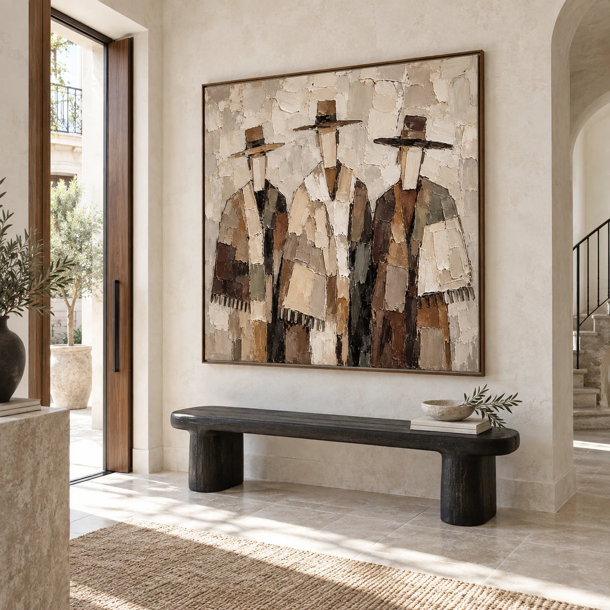 Large square artwork above a sculptural foyer bench in a gallery-scale entry.