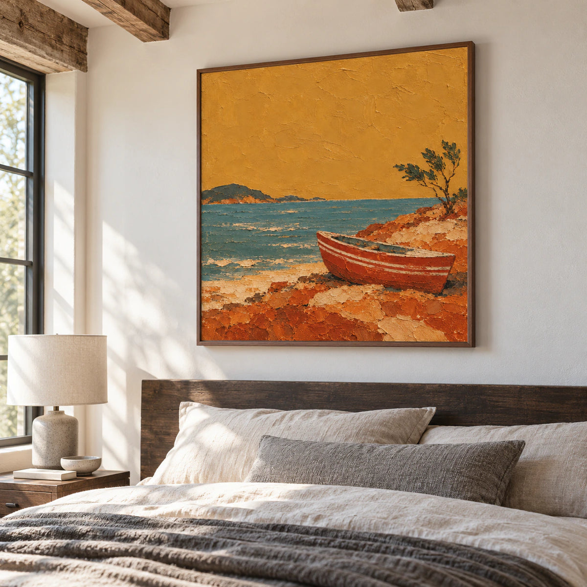 Large square painting of a small boat on teal water above a quiet bedroom’s low dark timber headboard, with soft daylight and pale linen.