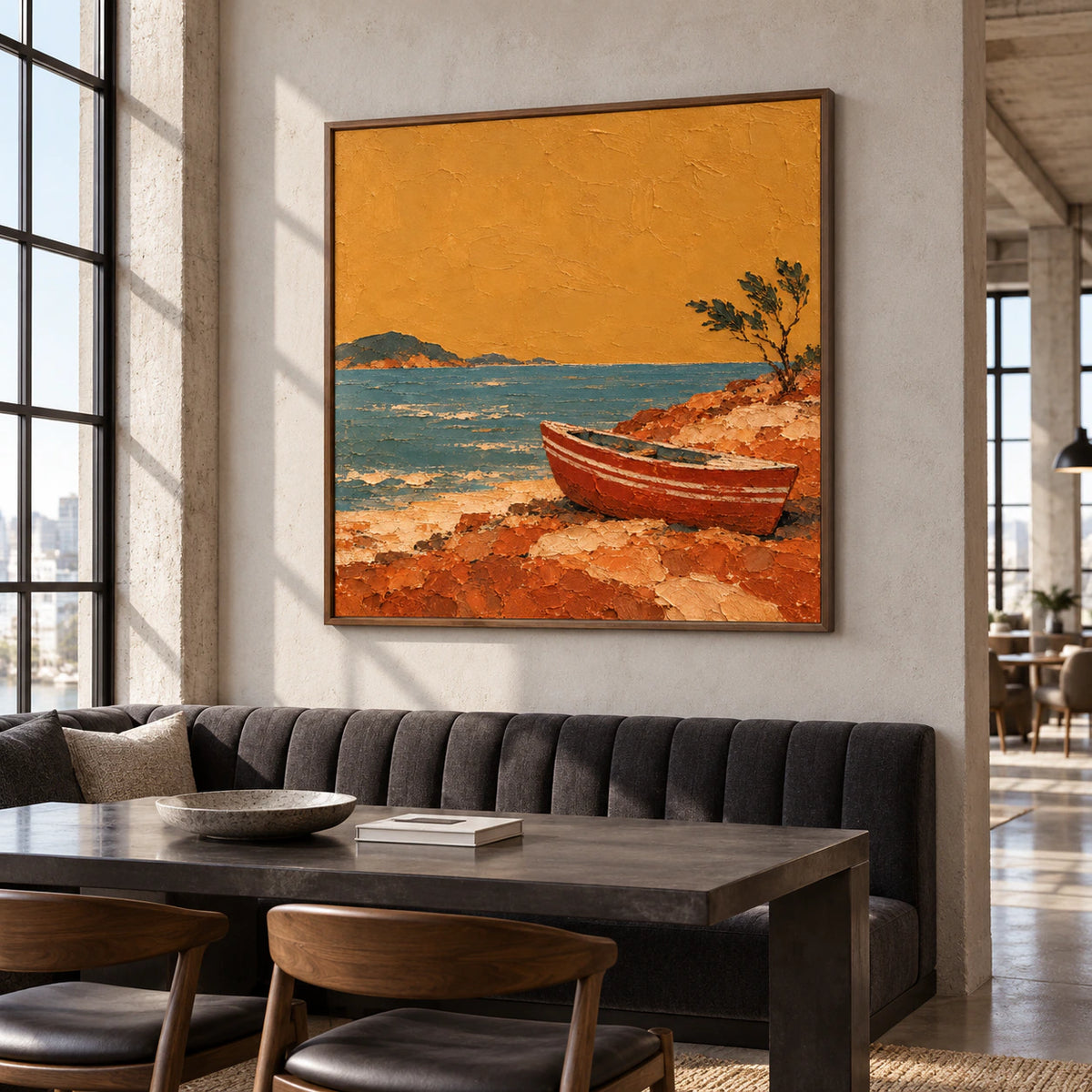 Square textured painting above a long charcoal banquette in a bright, expansive loft hospitality interior with concrete columns and tall glazing.
