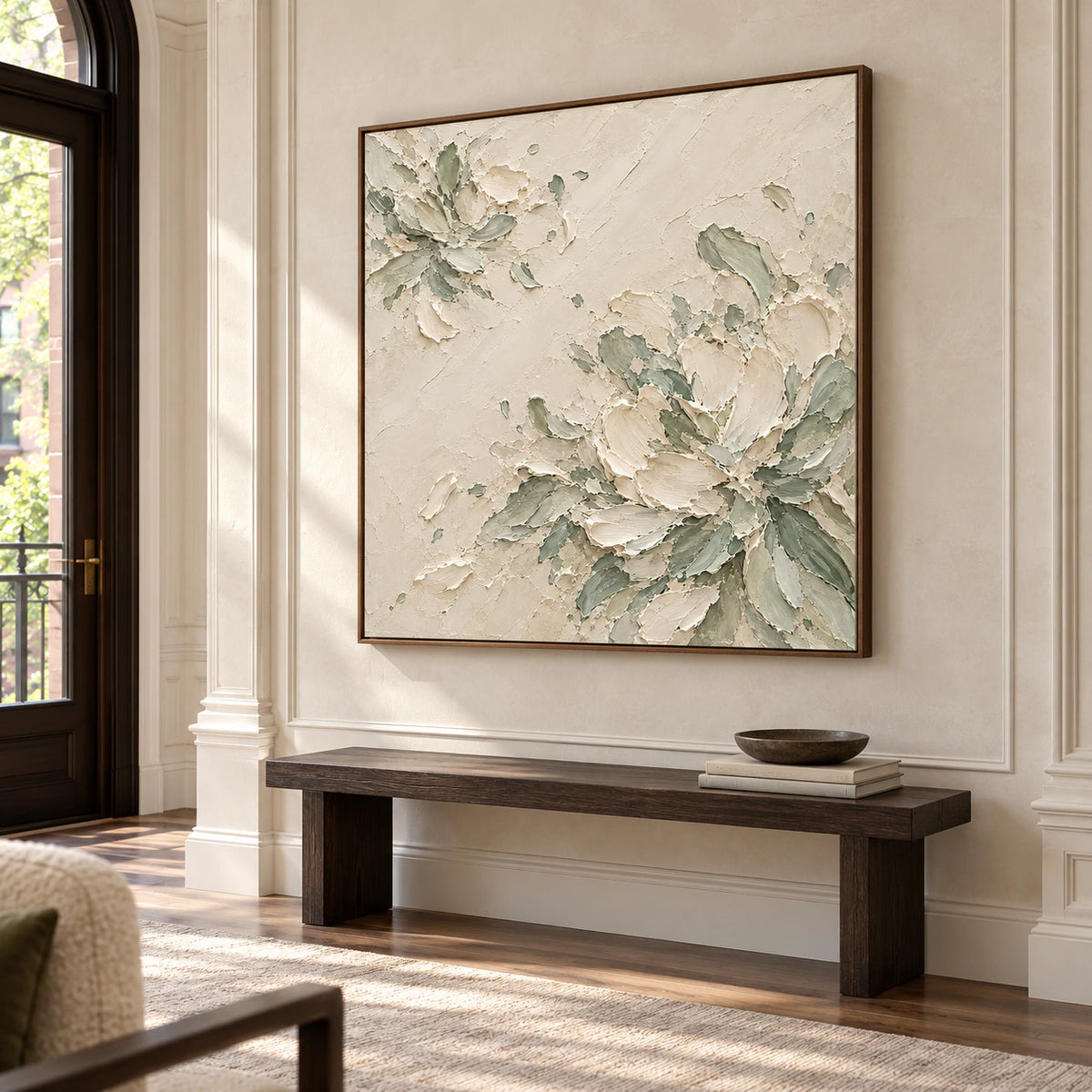 Large square artwork commanding a bright gallery-scale foyer with pale limestone walls, a restrained bench and open floor space.