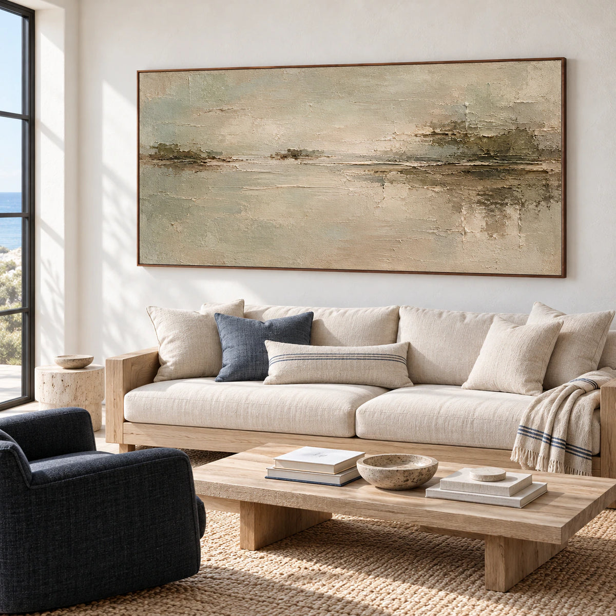 Sanded-Passage displayed above a simple sofa against a pale plaster wall in a bright living room with daylight from a side window.