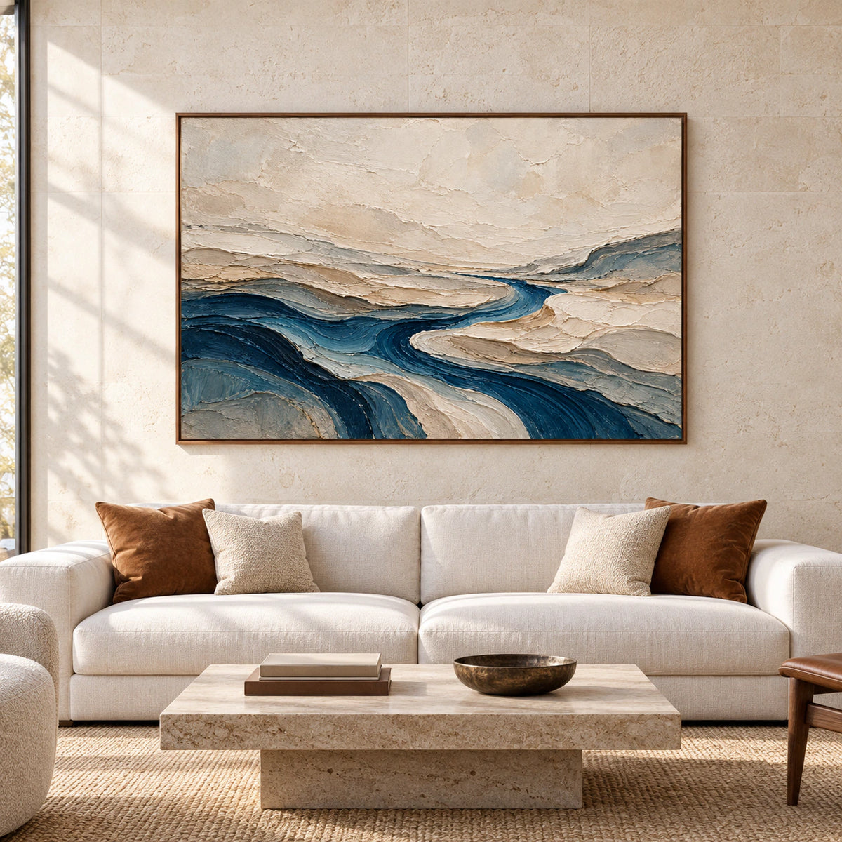 Large horizontal abstract painting of ivory ridges and a deep blue winding channel displayed in a spacious modern room.