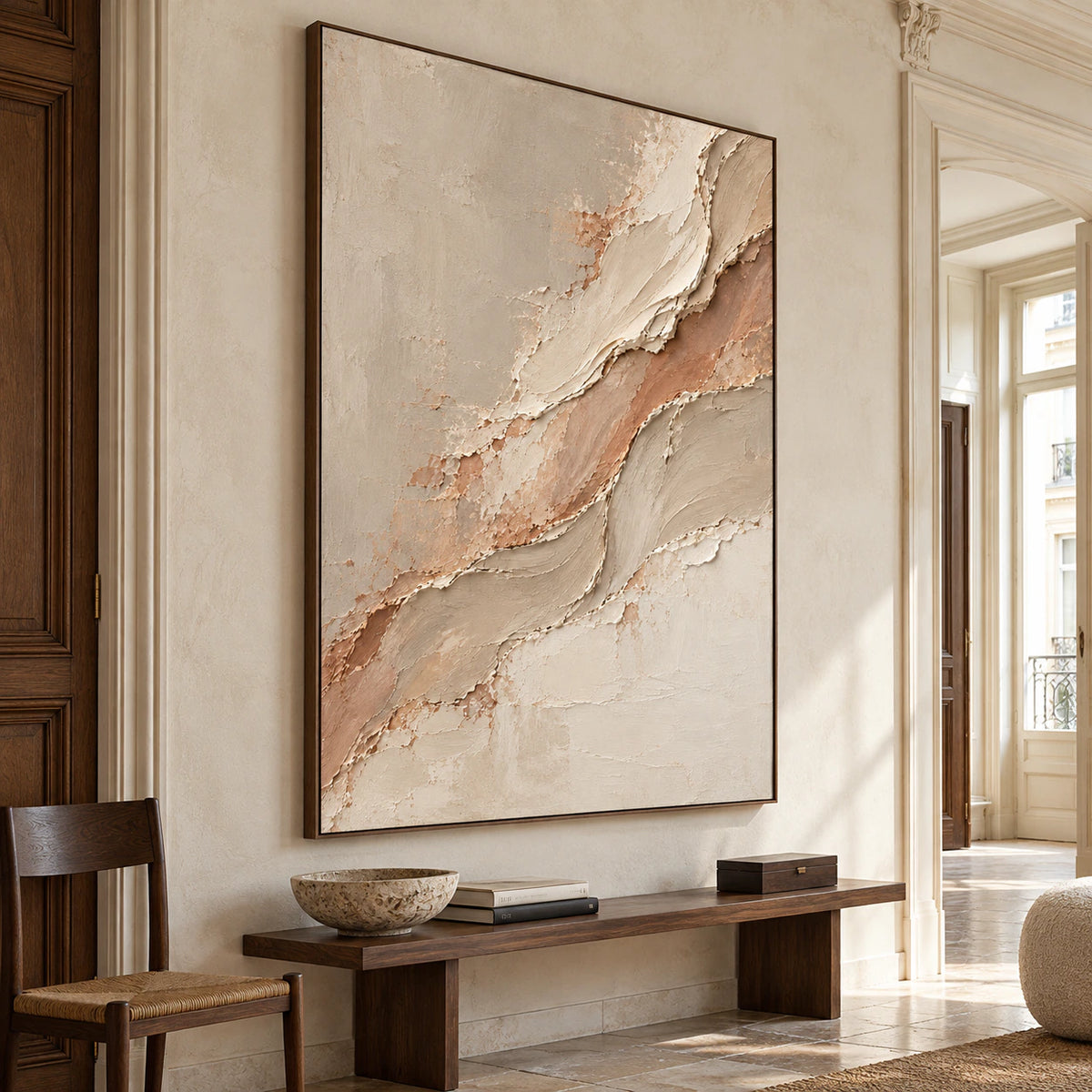 Gallery-scale artwork commanding a bright foyer with a tall ceiling, stone floor and restrained dark wood furnishings.