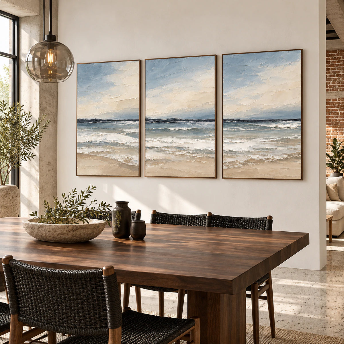 Refined dining room with the Seafoam-Interval walnut-framed coastal triptych.