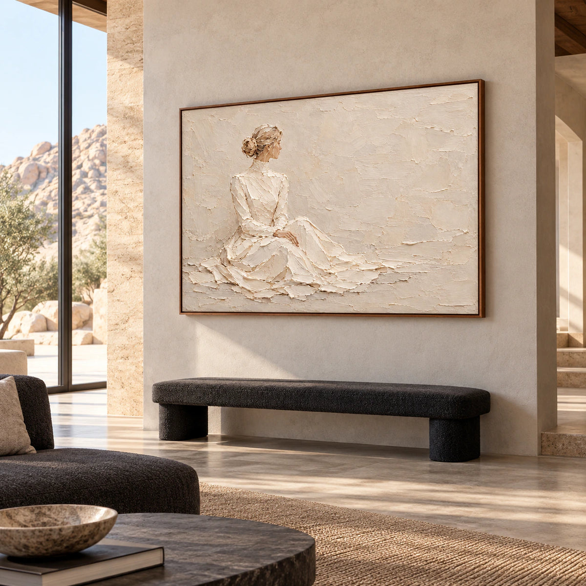 Large-scale seated-figure artwork in a spacious loft interior with concrete surfaces, restrained dark furniture, and bright natural light.