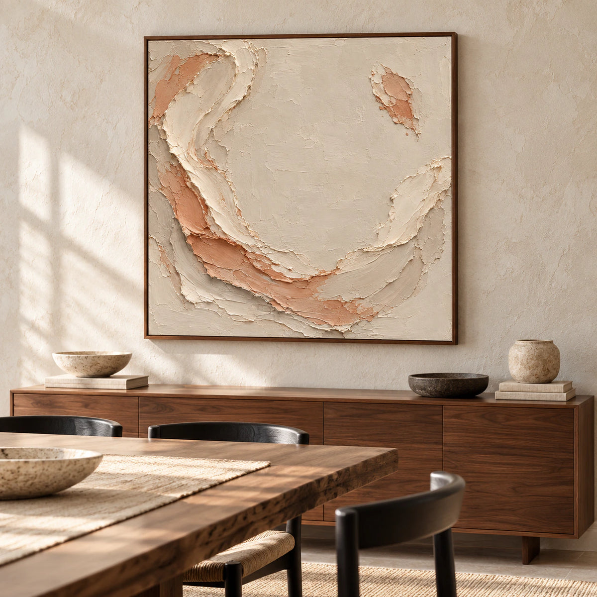 Shell Mantle anchors a refined dining room above a dark wood sideboard, with a long dining table and softly lit stone walls.