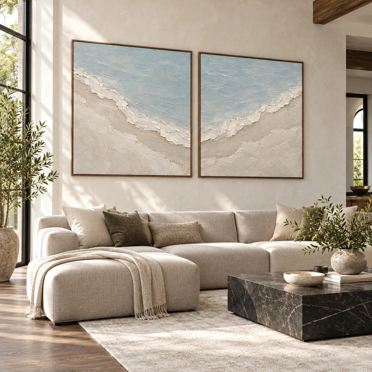 Shoreline-Relief diptych above a bright contemporary living-room seating arrangement.