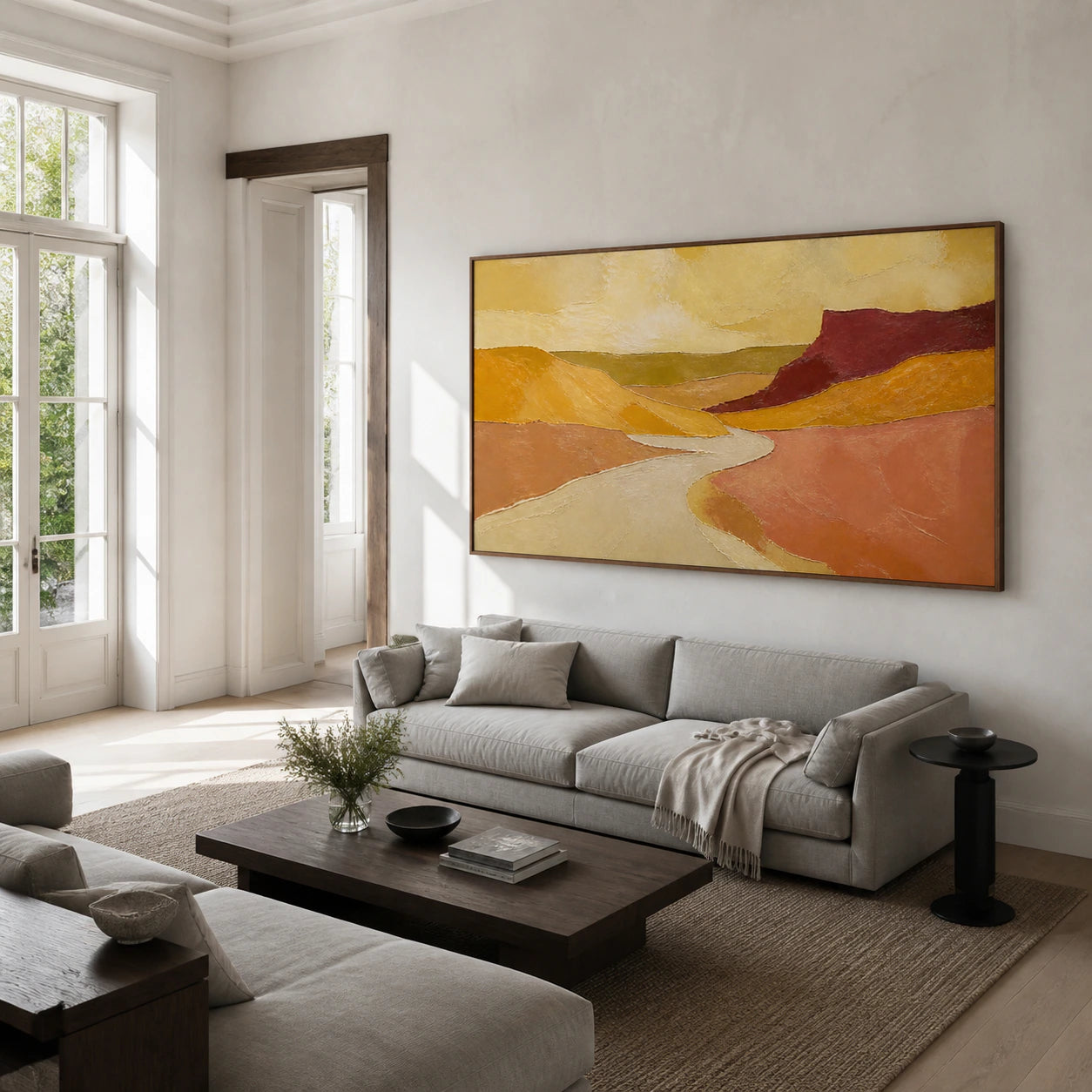 Sienna-Delta above a restrained sofa in a bright contemporary living room.