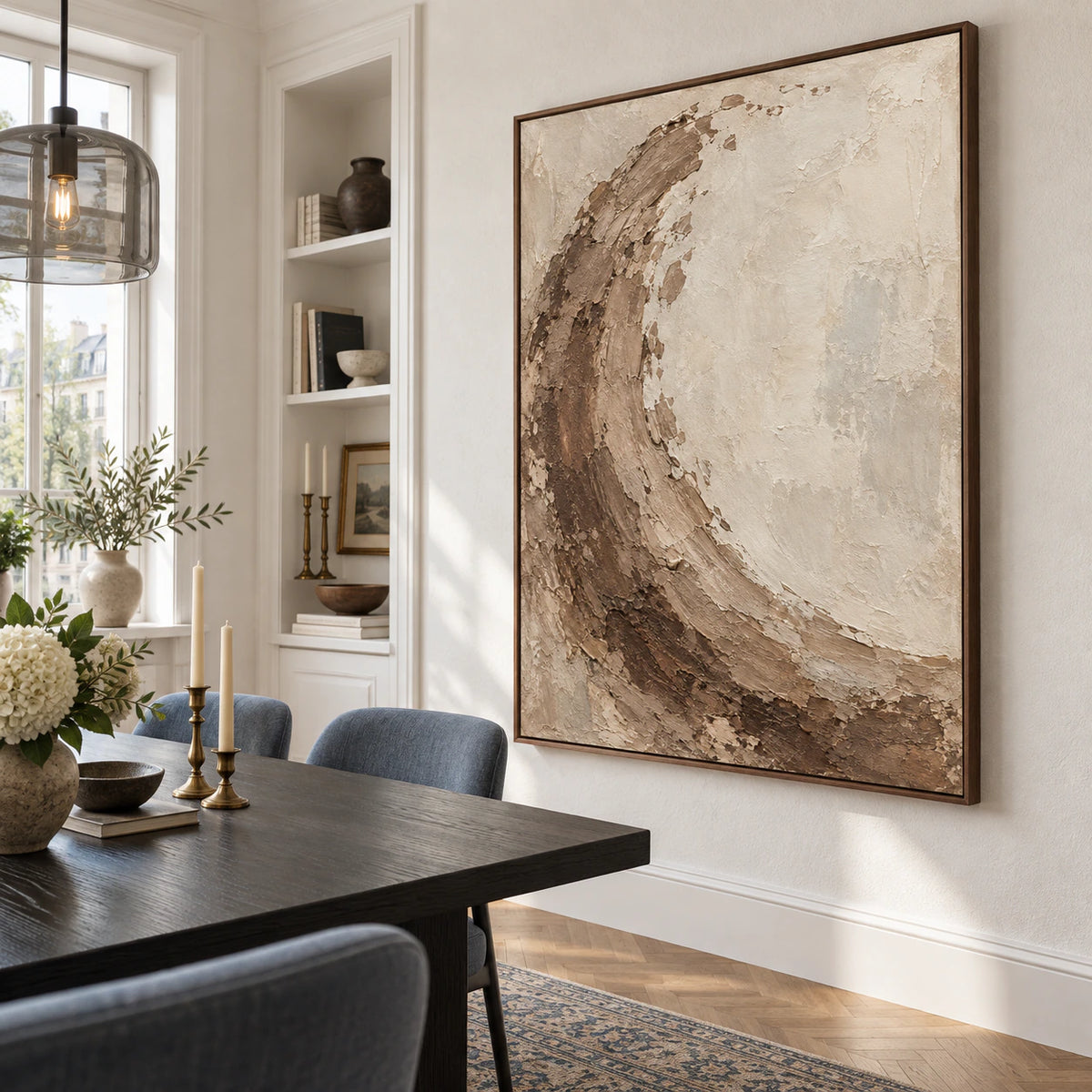 Vertical sienna and ivory textured abstract painting above a refined dining setting.