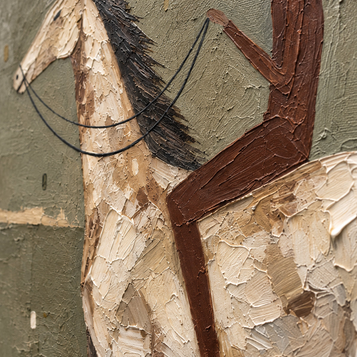 Sienna-Rider oil painting brushwork and impasto detail photographed from an oblique side angle