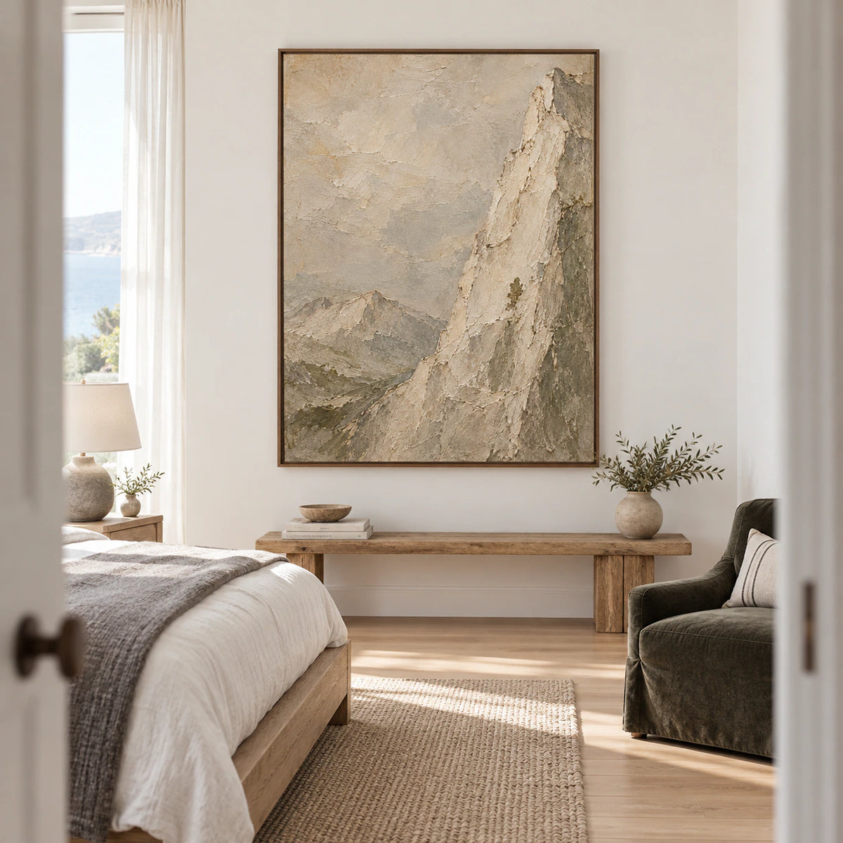 Vertical mountain artwork bringing a quiet focal point to a serene bedroom.