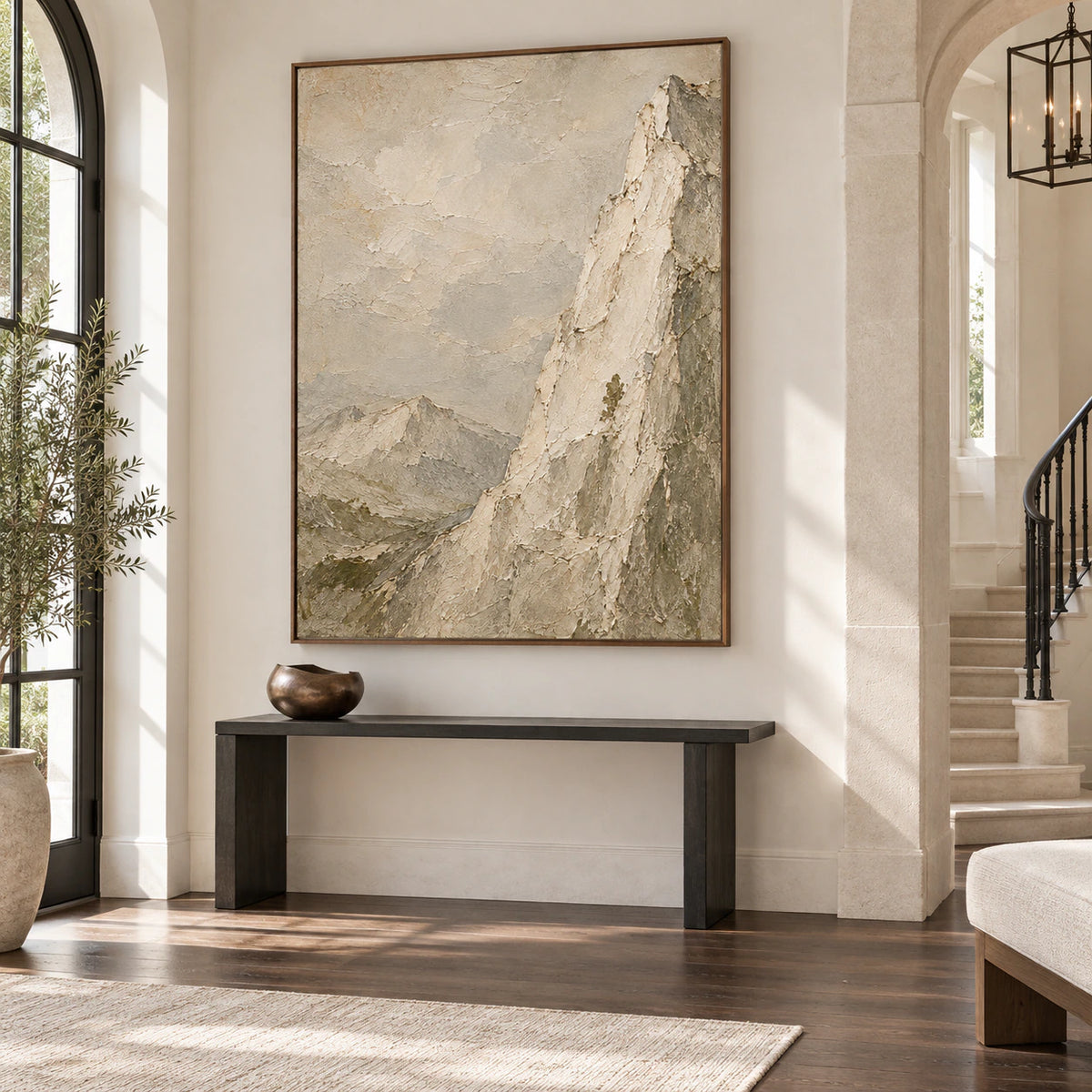 Large vertical mountain artwork anchoring a gallery-scale foyer.