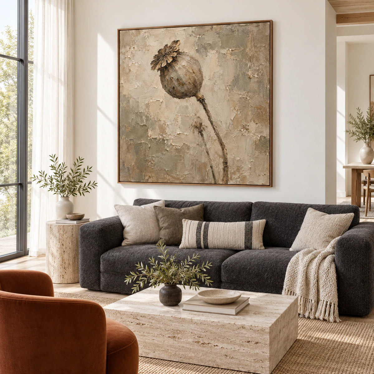 Large square floral artwork above a restrained bright living room seating arrangement.