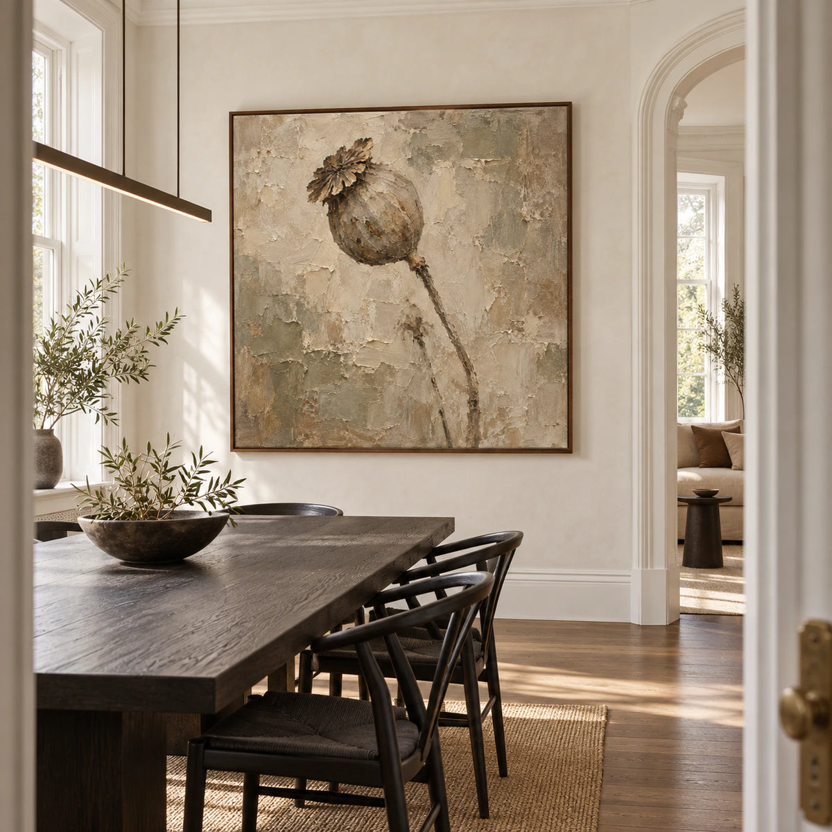 Textured square floral painting anchoring a refined sunlit dining room.