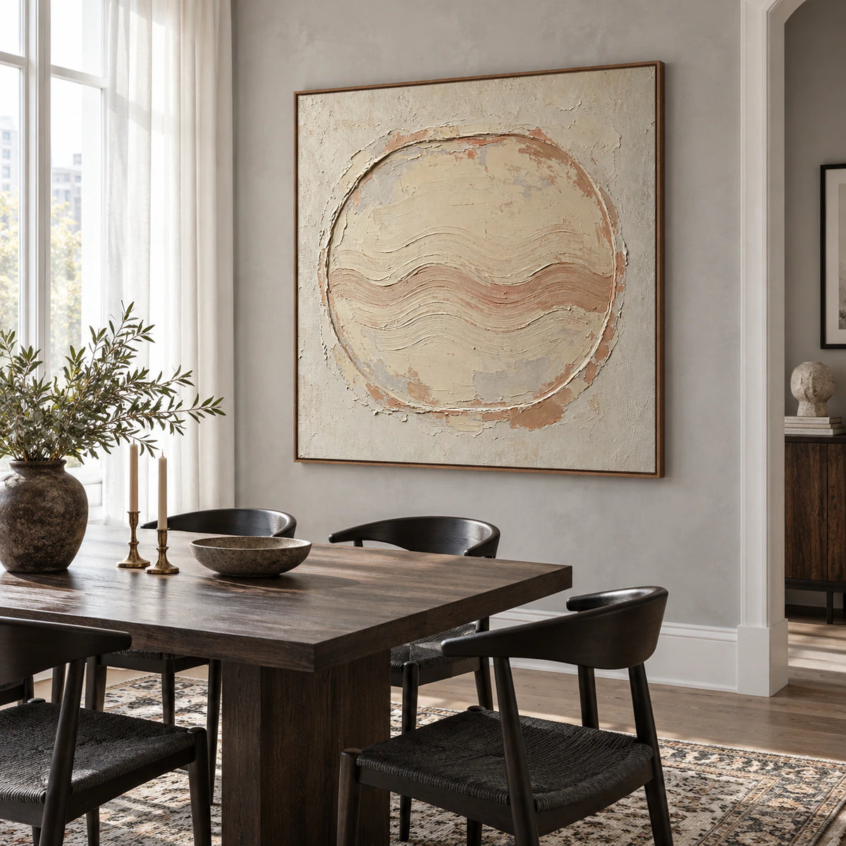 Square textured circular abstract painting in a refined daylight dining room.