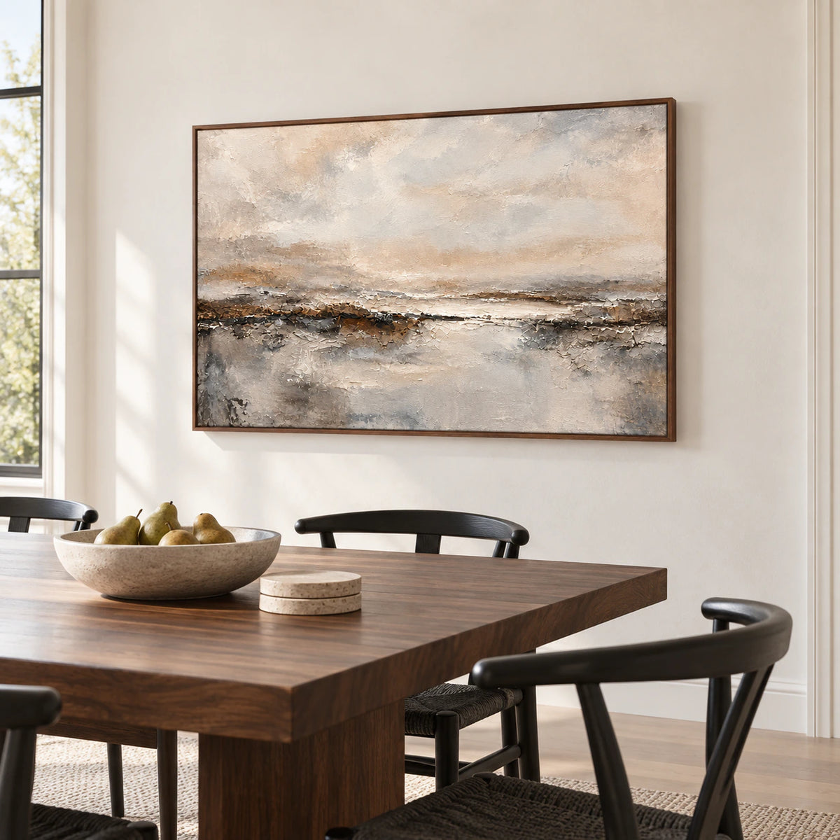 Large abstract painting on a bright dining room wall above a restrained dark wood dining table, viewed from the left.