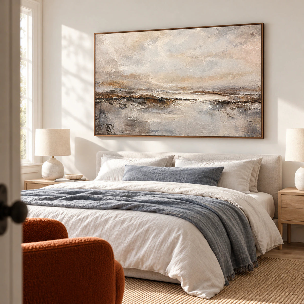 Textured horizon painting prominently displayed above a low bed in a quiet, sunlit bedroom with muted linen bedding.