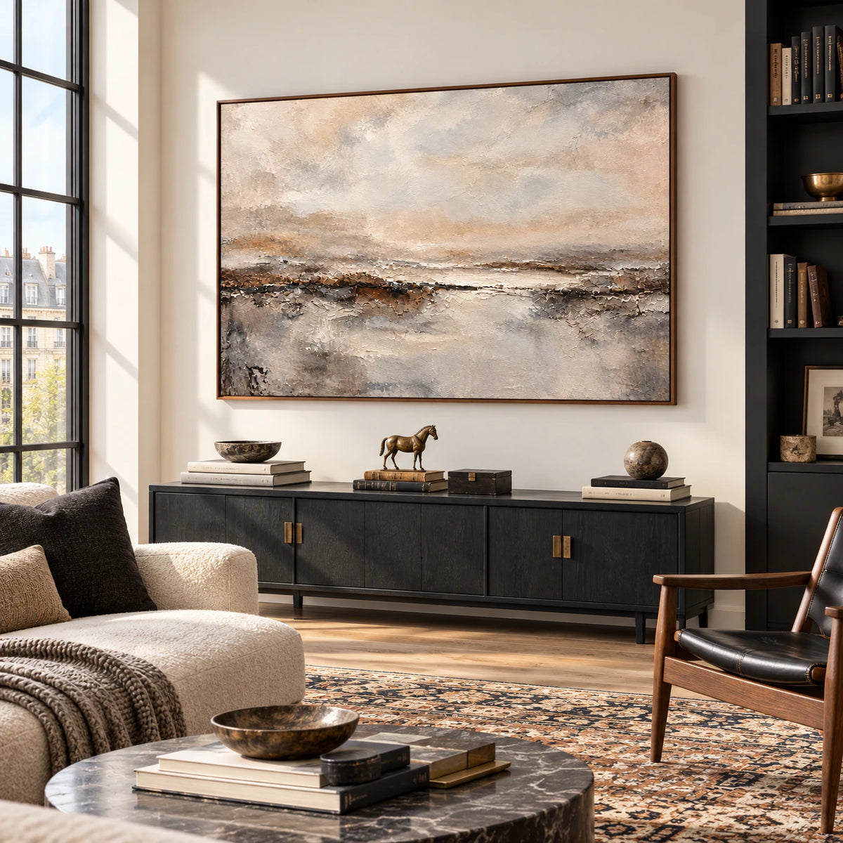 Large abstract landscape featured in an expansive loft interior with tall windows, restrained furnishings, and clear daylight.