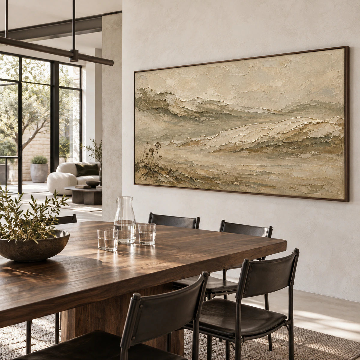 Silt-Ridge landscape painting as the focal point of a refined daylight-filled dining room.
