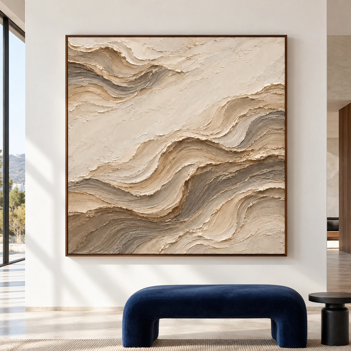 Large square abstract artwork with flowing ivory, sand and taupe ridges displayed straight-on in a spacious, light-filled gallery room.