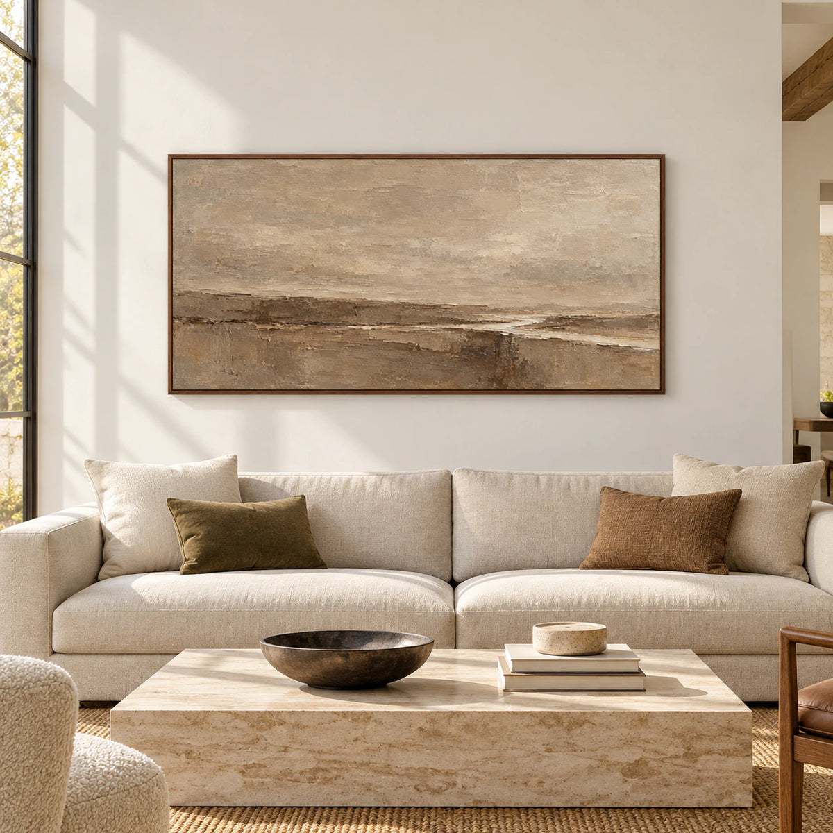 Large horizontal sand, taupe and umber abstract painting viewed straight on in a spacious, bright architectural interior with natural daylight.