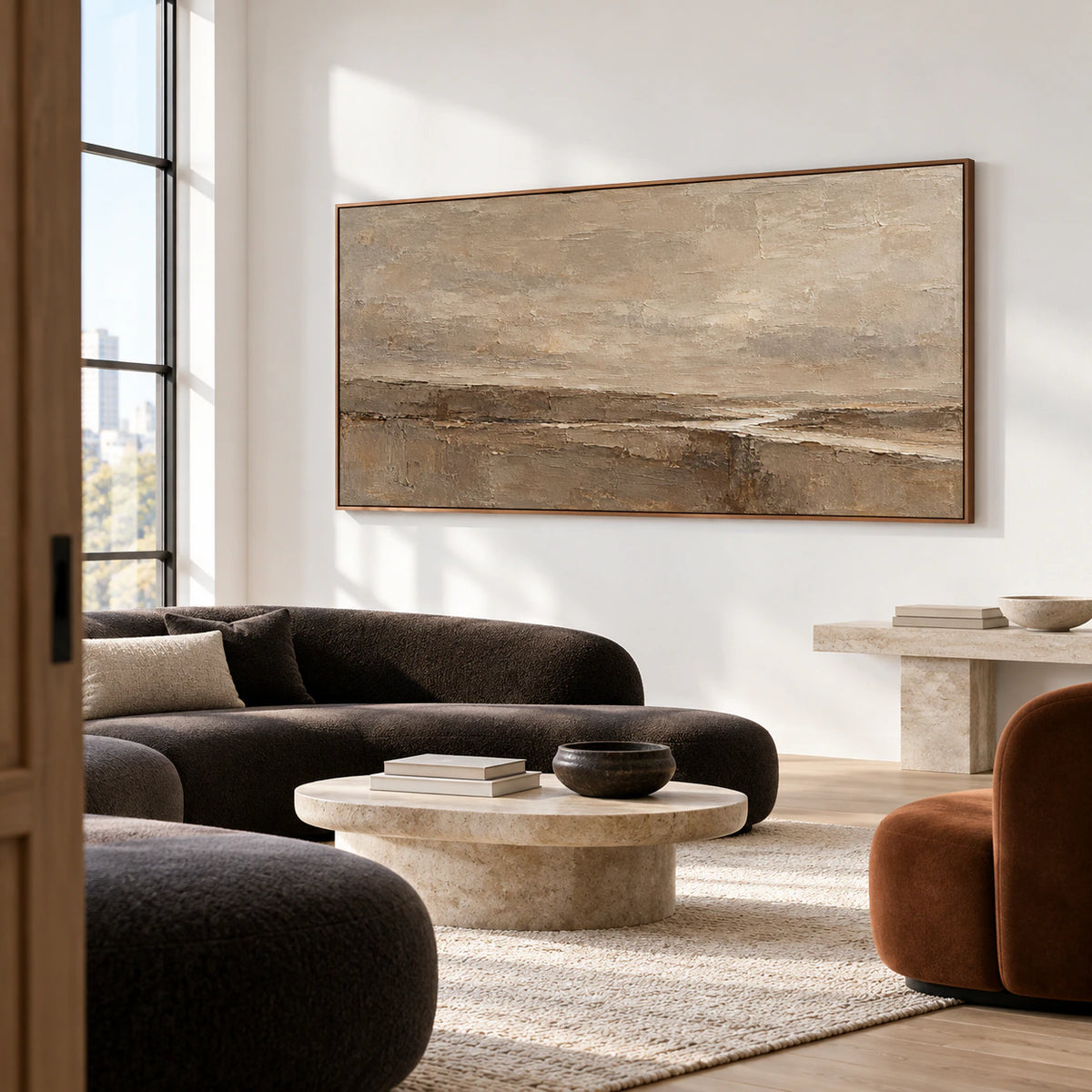 Large neutral abstract painting on a cool white wall in a spacious loft lounge with sculptural dark seating and generous windows, viewed from a distance on the left.