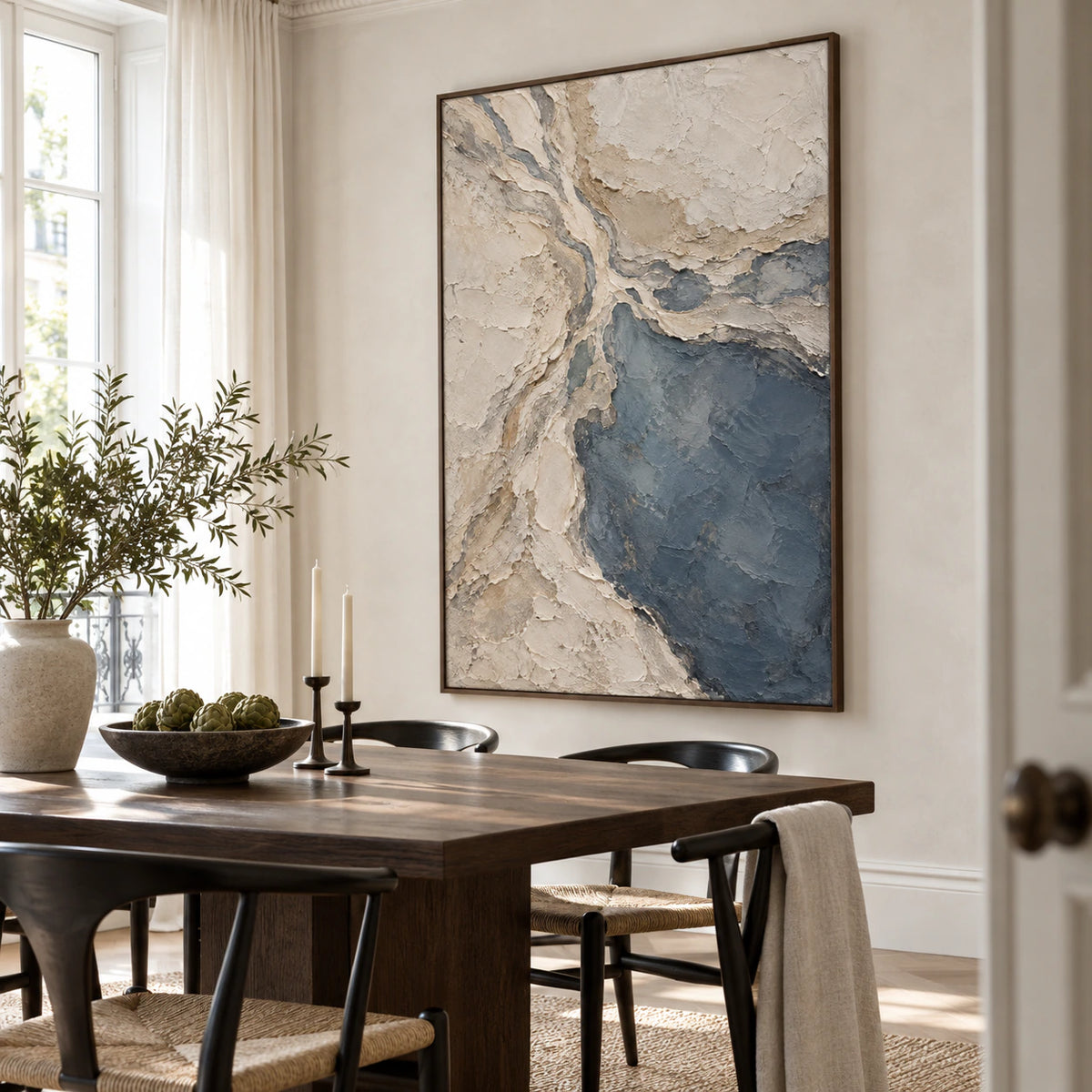 Slate-Confluence as a large-scale focal point in a refined daylight dining room.