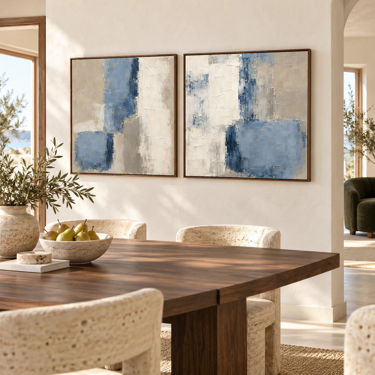 Slate-Interval blue and ivory diptych in a refined daylight dining room.
