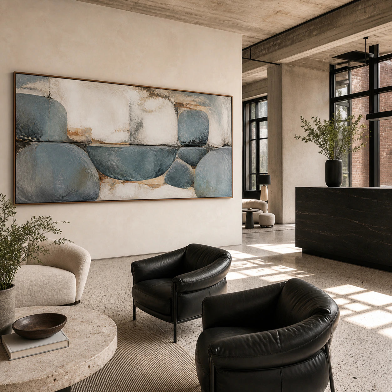 Expansive loft hospitality interior centered on the weathered blue-grey abstract painting.