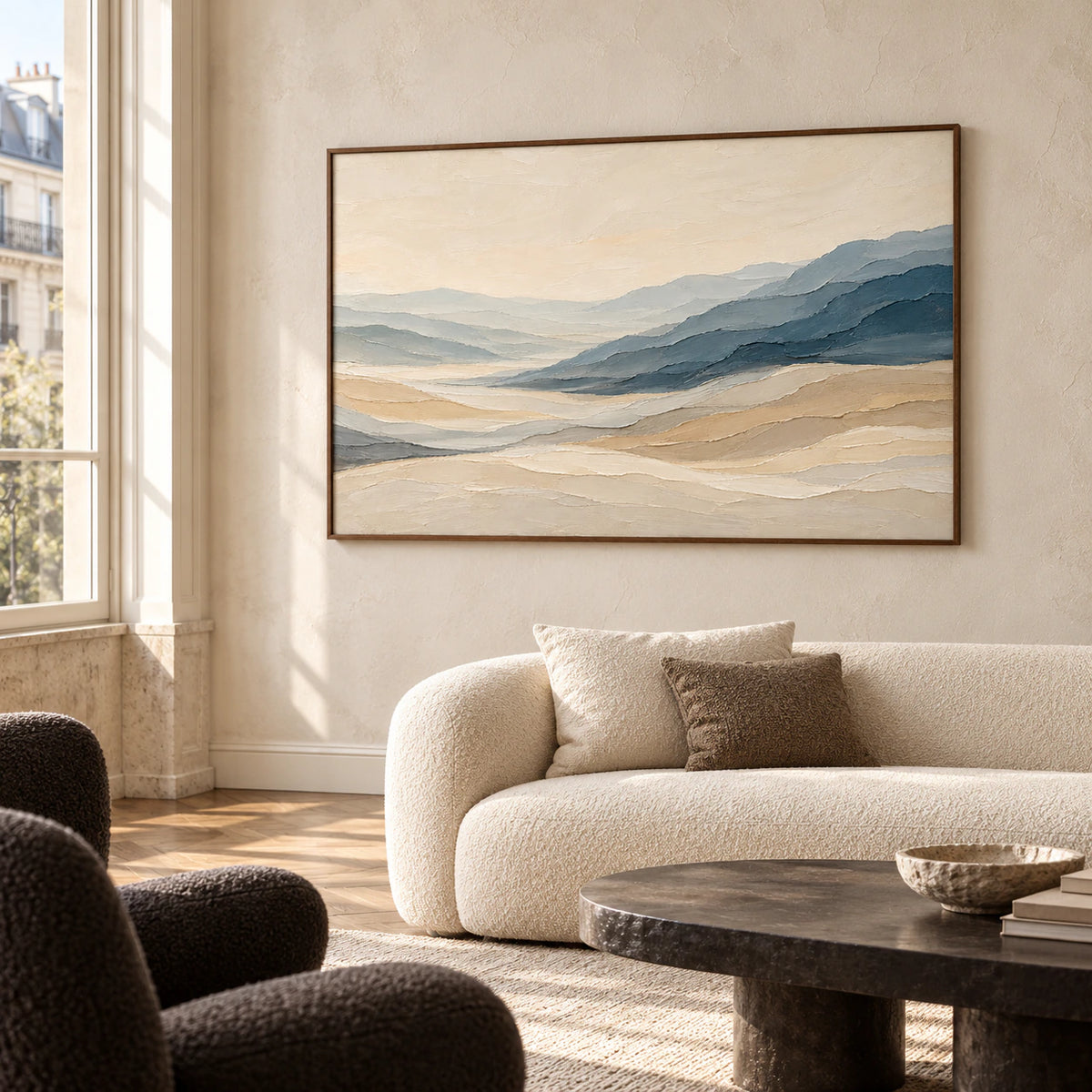 Large textured landscape artwork displayed in a bright loft interior with expansive windows and restrained furnishings.