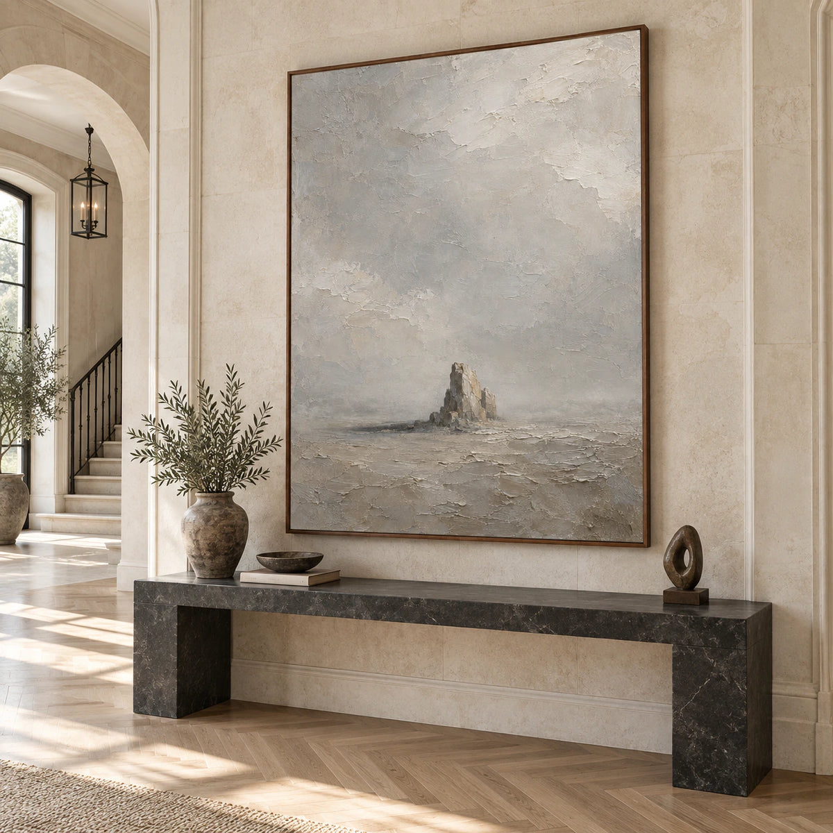 Solitary-Cairn at gallery scale in a bright architectural foyer.