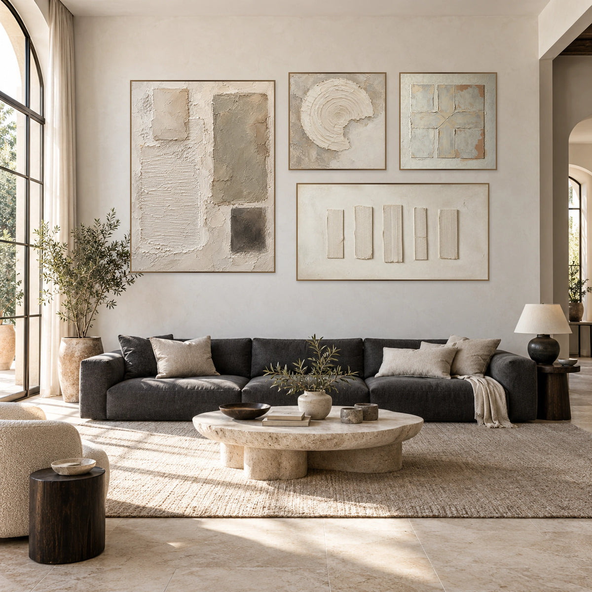 Mineral-Accord four-piece gallery wall, with a portrait, two square artworks and a panoramic artwork above a charcoal sofa.