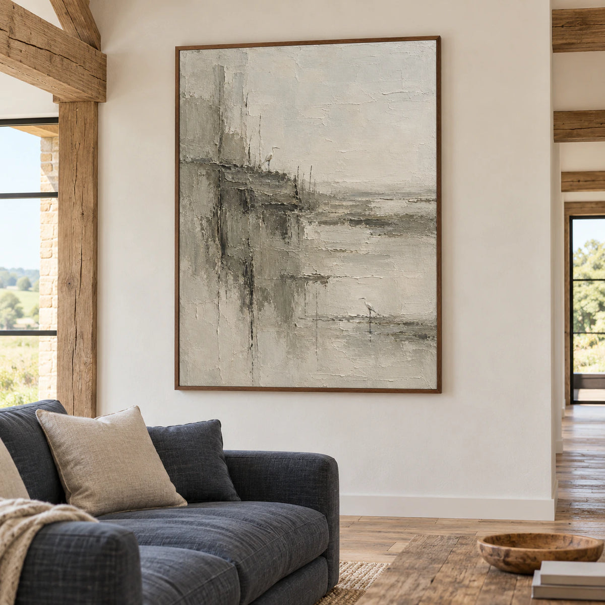 The large vertical heron artwork above a restrained sofa in a bright living room.