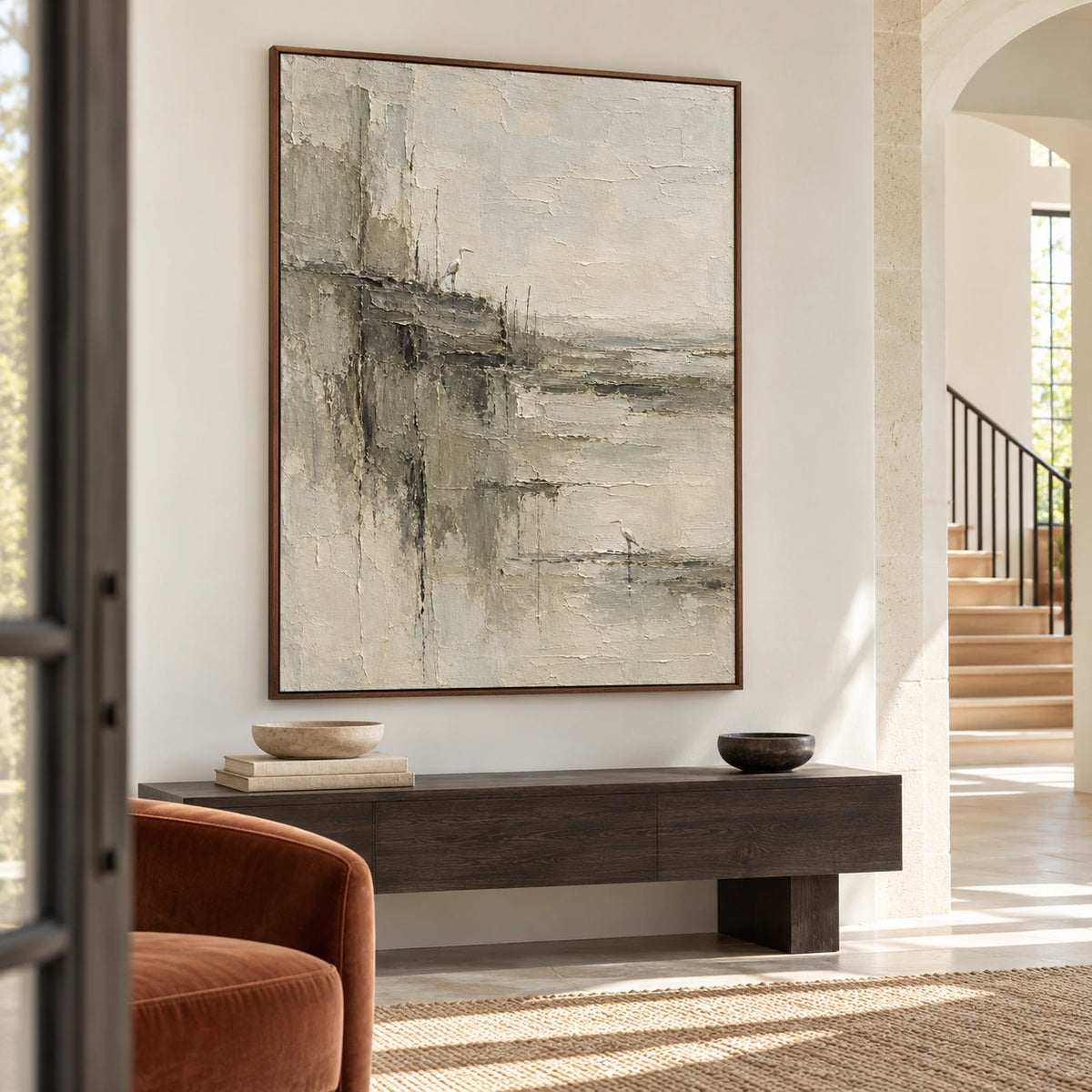 The large painting commands a gallery-scale foyer with open floor space and soft daylight.