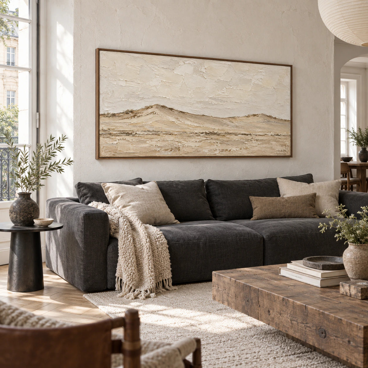Still-Ridge above a restrained seating arrangement in a bright living room.