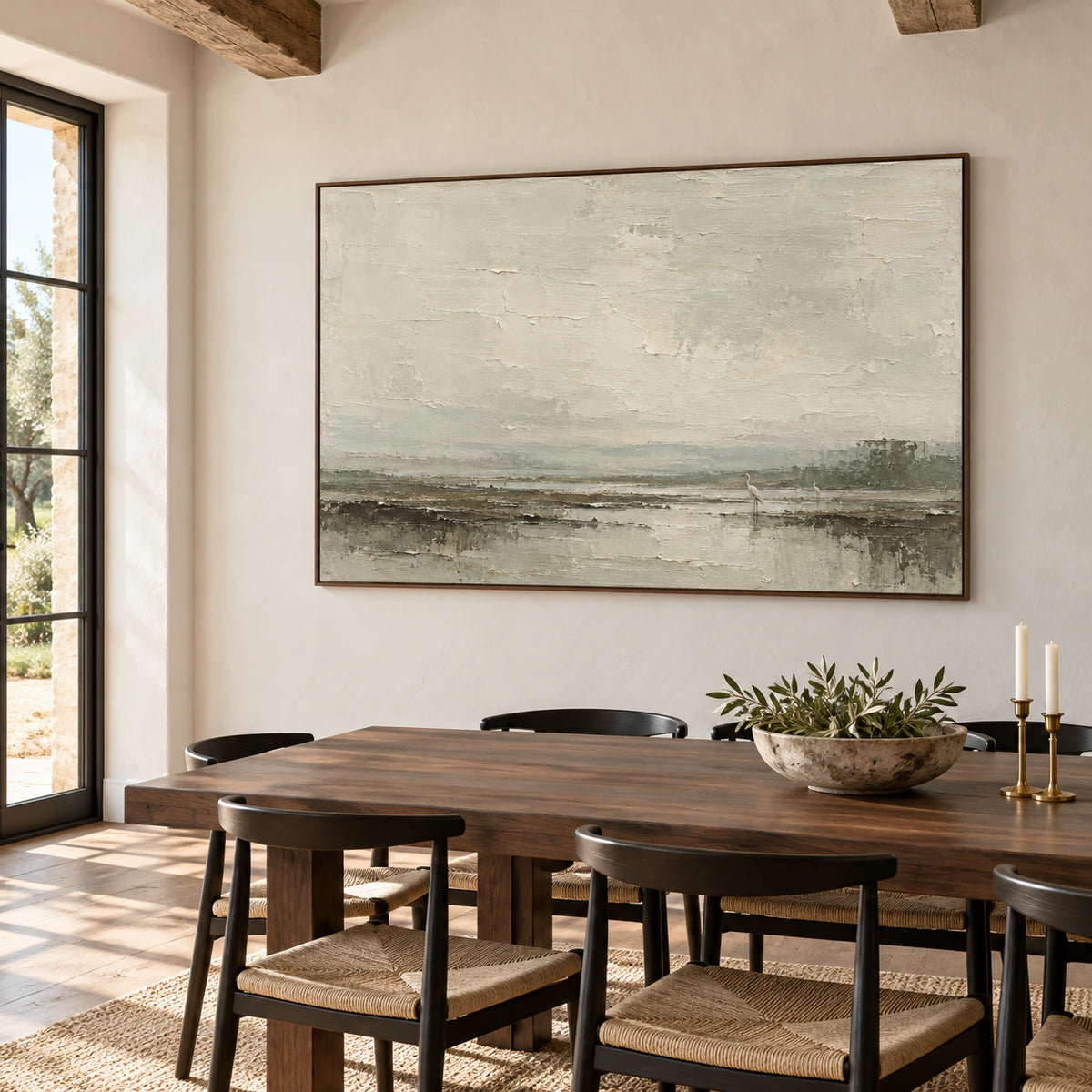 Textured marsh landscape anchoring a refined dining room above a dark wood table, with its layered shoreline and birds in view.